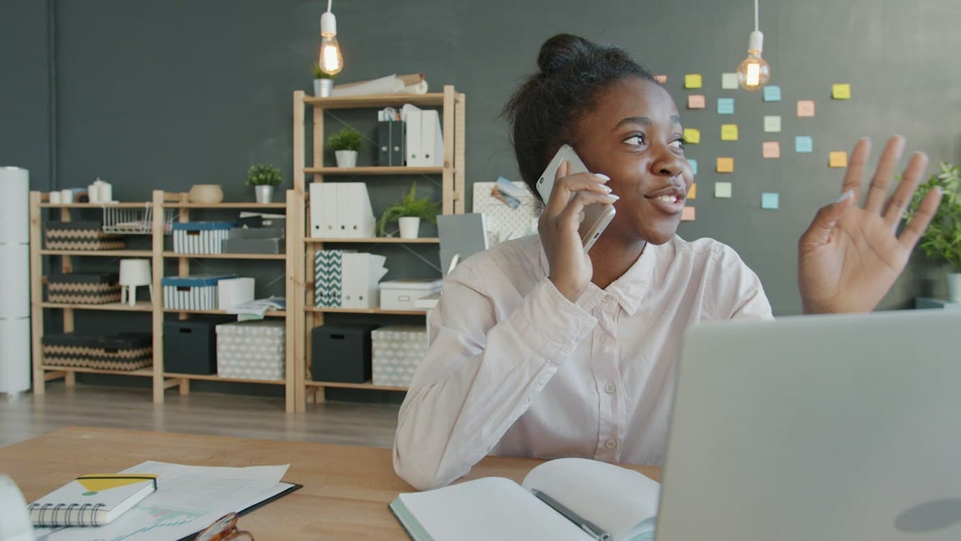 A professional reviewing figures at her desk
